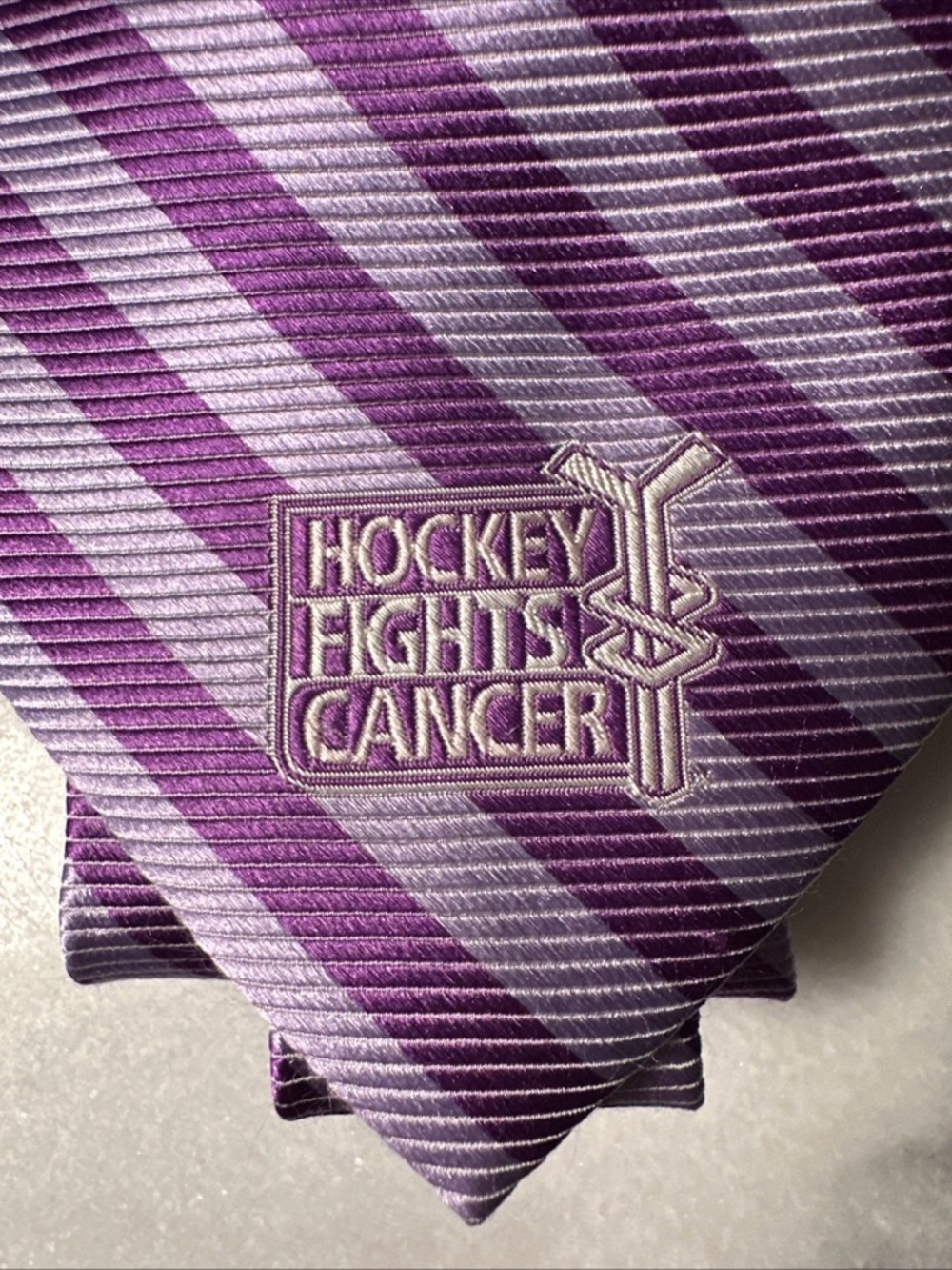 NHL Lavender and Deep Purple Striped Men's Tie with Hockey Fights Cancer Patch